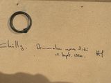a piece of paper with writing on it and a pair of scissors