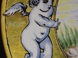 a plate with a painting of a cupid on it