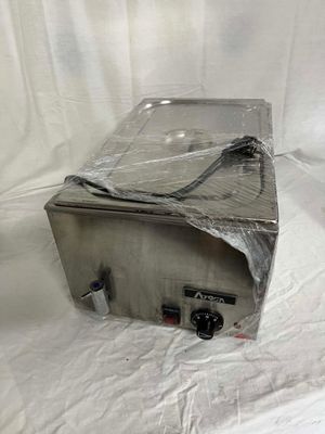 an image of a toaster sitting on a sheet of plastic