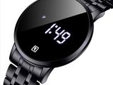an image of a black watch with a digital display on the face