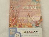 the book paul signac is sitting on a white surface