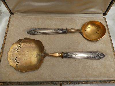a box with two spoons and a ladle in it