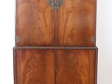 an image of a wooden cabinet sitting on top of a hard wood floor