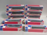 six boîtes contenant des manettes Nintendo Wii posées sur une table