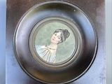 a picture of a picture of a woman on a plate