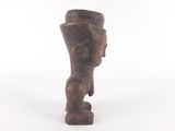 an old wooden statue of a man with a hat on his head