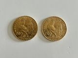 two gold coins, one of which is a rooster and the other of which is a bird