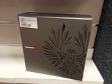 a box with a picture of a bird on it sitting on a shelf