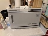 a towel warmer sitting on top of a counter in a kitchen
