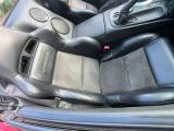 a picture of the inside of a car with leather seats