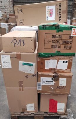 boxes stacked on top of each other on a pallet in a warehouse