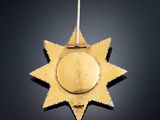 a close up of a gold medal on a black background