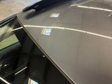 a close up of a car ' s hood with a window open