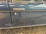 a close up of a car door handle with a sticker on it
