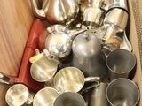 a box full of silver items sitting on the floor