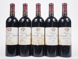 six bottles of red wine are lined up in a row