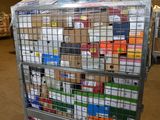 a metal cart with many boxes on it in a warehouse