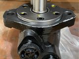 a close up of a hydraulic gear pump on a table