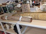 a long piece of art on a table in a store