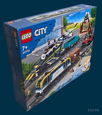 a box of lego city trains on the tracks