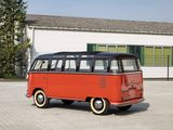a red vw bus parked in front of a white building