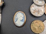 some coins and a watch sitting on a table