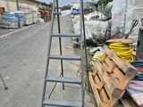 a ladder that is sitting on the side of the road