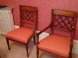 two chairs in a room with a radiator and a radiator