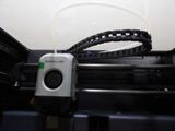 an image of a printer with a cable connected to it