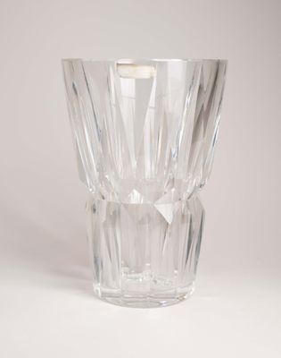 a clear glass vase with a small candle inside of it