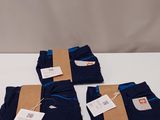 three pairs of men ' s blue pants with tags on them