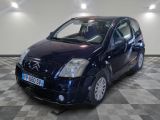 a picture of a small blue car on a checkered floor