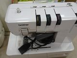 a sewing machine that is sitting on top of a box
