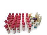a lot of bottles that have different types of skin care products in them