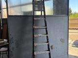 a ladder that is leaning against a wall