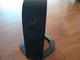 a computer on a table with a power cord plugged into it