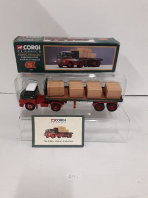 a toy truck with boxes on the back of it