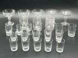 a lot of glasses that are sitting on a table