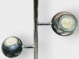 a close up of two lights on a pole