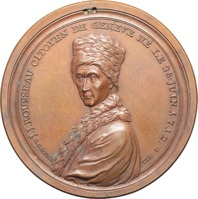 une image d'une médaille de bronze représentant une femme portant un turban