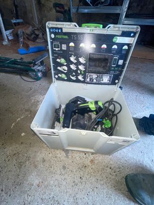 a tool box with tools in it sitting on the floor