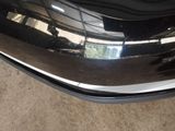 a close up of a car ' s front bumper