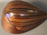 a wooden instrument that is sitting on a table
