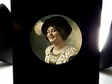 a black card with a picture of a woman in a hat