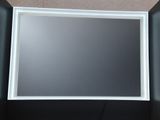 la photo d'une photo d'un miroir dans une boîte