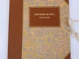 an image of a book with a brown cover on a white table