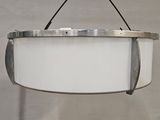 a white light hanging from the ceiling in a room