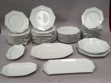 a lot of plates that are sitting on a table