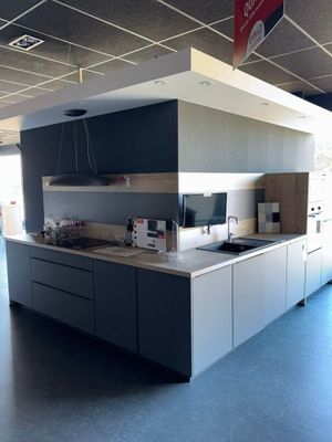 a kitchen with a large island in the middle of the room