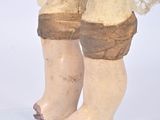 a statue of a woman ' s legs and feet with a lace over them